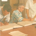 Bess and Flores sign the register